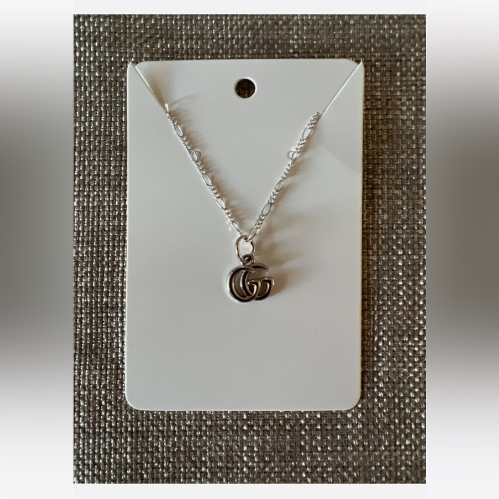 gucci charm/zipper pull repurposed to necklace